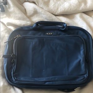 Blue Tumi Cosmetics travel case